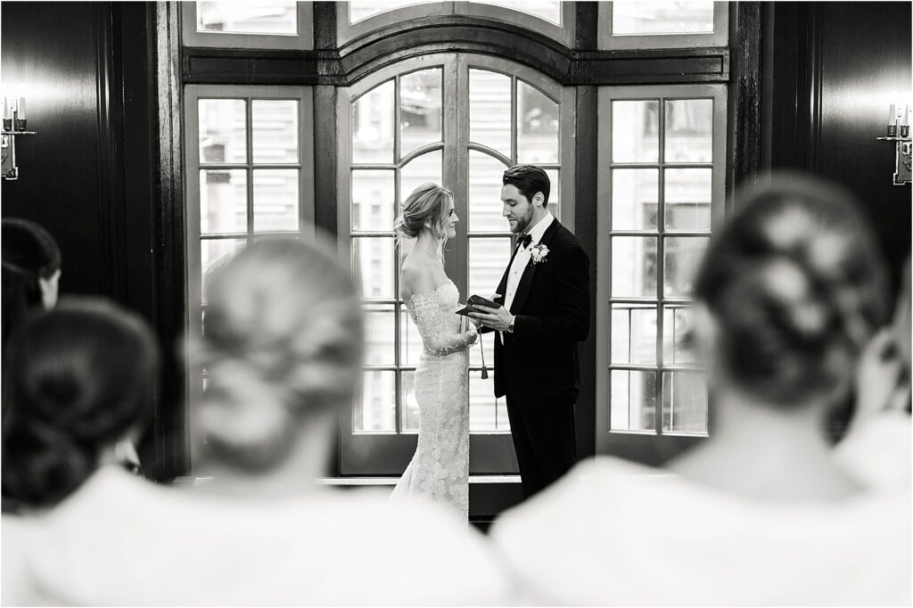 Bride and Groom reading personal vows at The Chicago Athletic Assocation