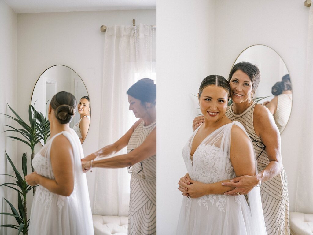 Bride getting dressed with mother