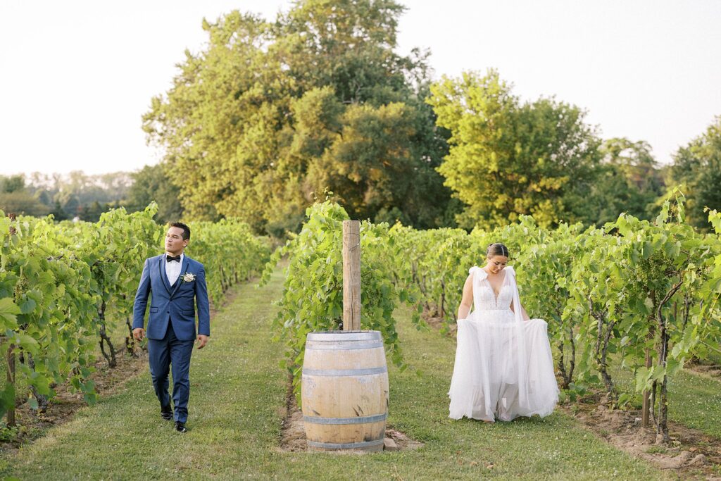 BRIDE AND GROOM IN VINEYARD